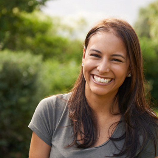Woman smiling outside