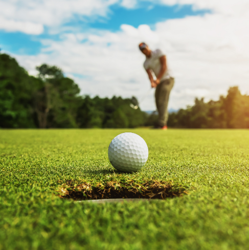 Man hitting a golf ball
