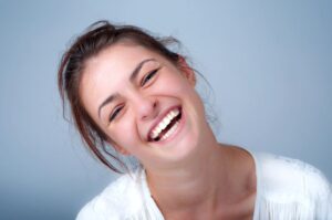 Portrait of smiling young woman with beautiful teeth