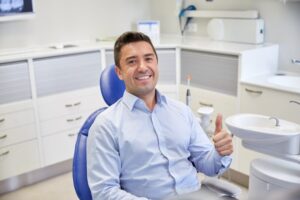Man smiling after getting a root canal