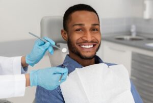Man smiling after his root canal